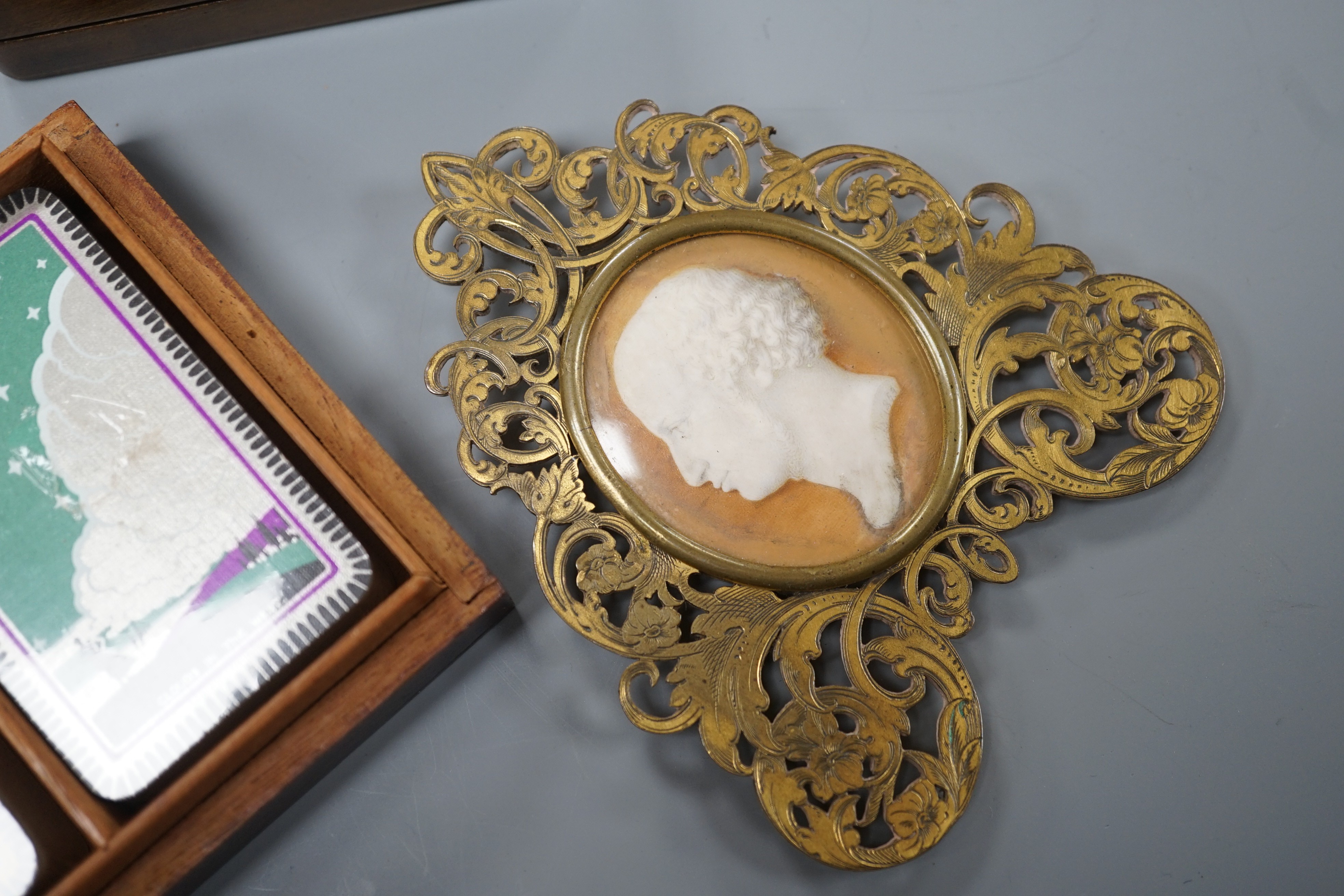 A mid 19th century portrait miniature on ivory in a gilt brass frame, a Tunbridge ware playing card box, 10.7cm and a Swiss painted wood stamp box (3)